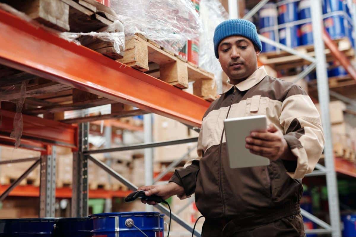Employee in a warehouse, picking orders