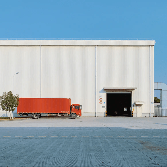 Red truck outside a warehouse